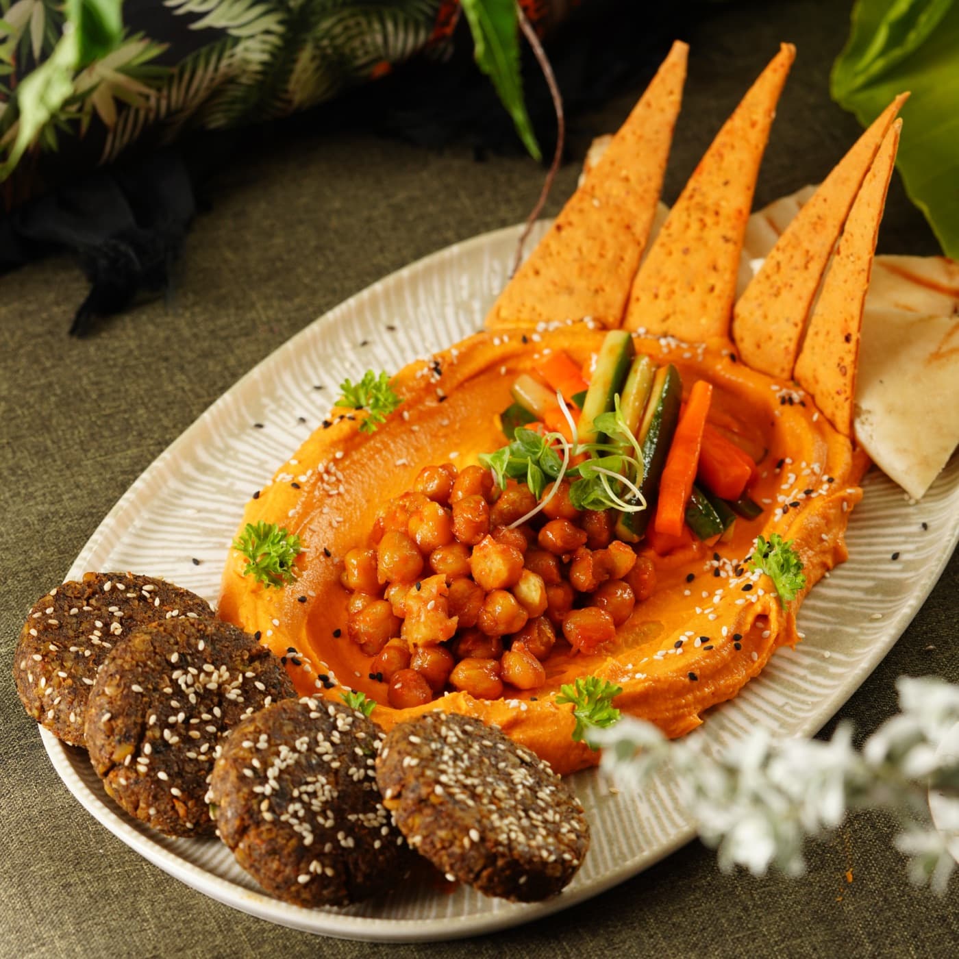 Harissa falafel over spiced hummus with crisp lavash