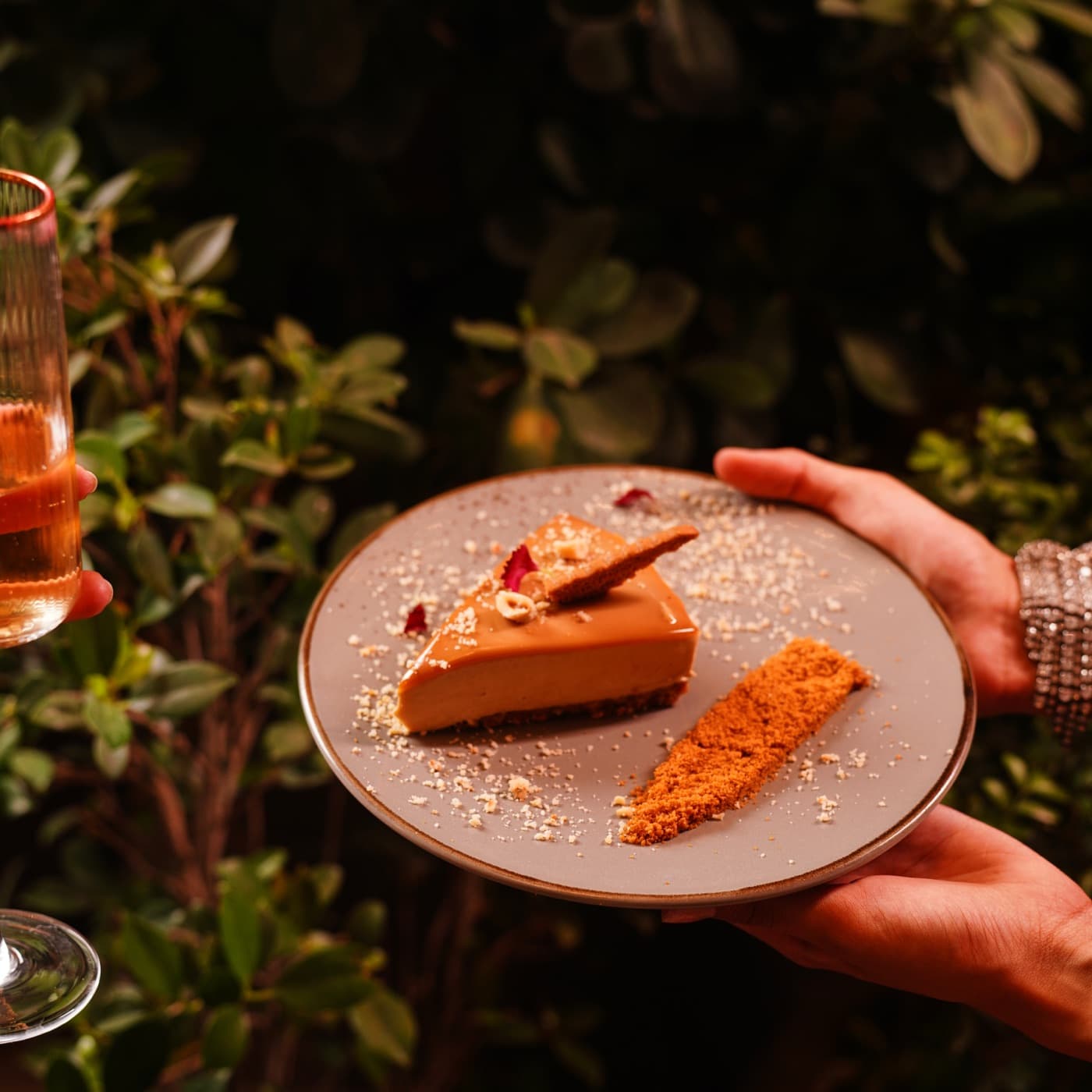 Dessert plate offered through the foliage