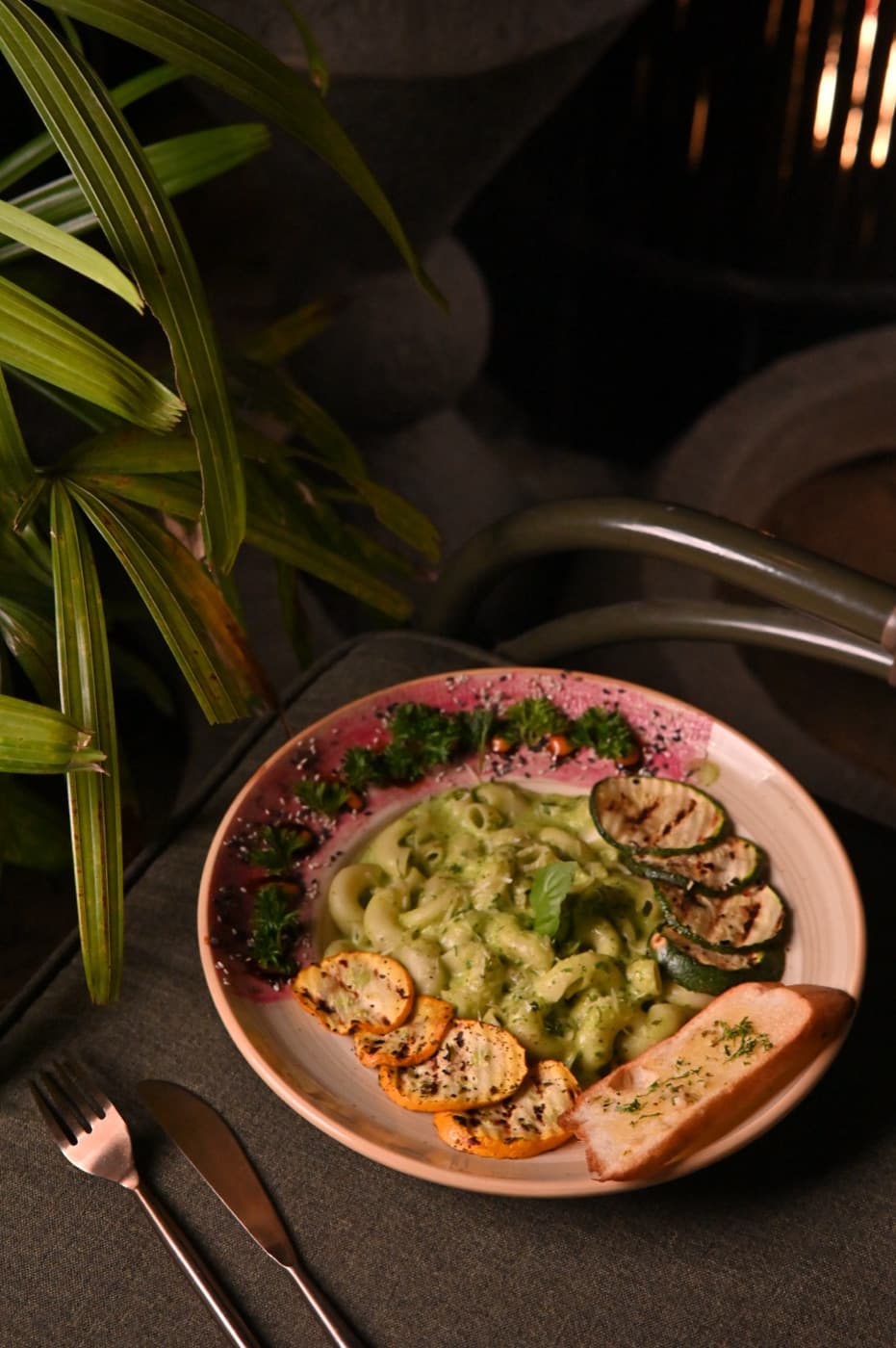 Candlelit dishes emerging from the dark