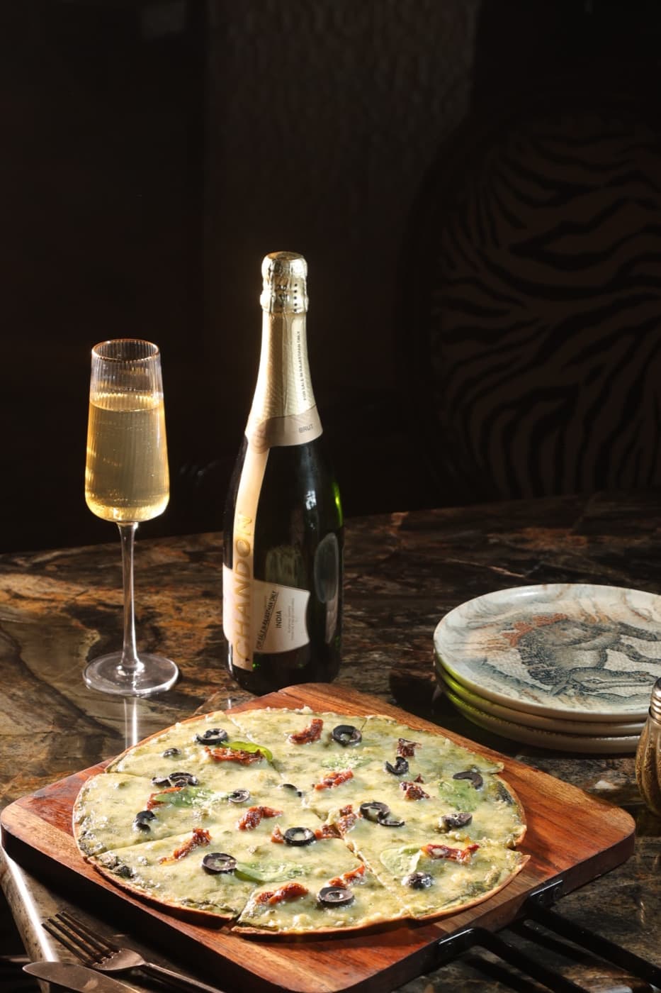 Wood-fired pizza with sparkling wine