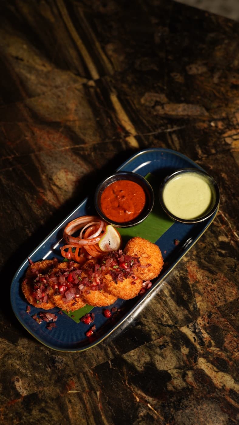 Char-kissed tandoori bites on dark stone