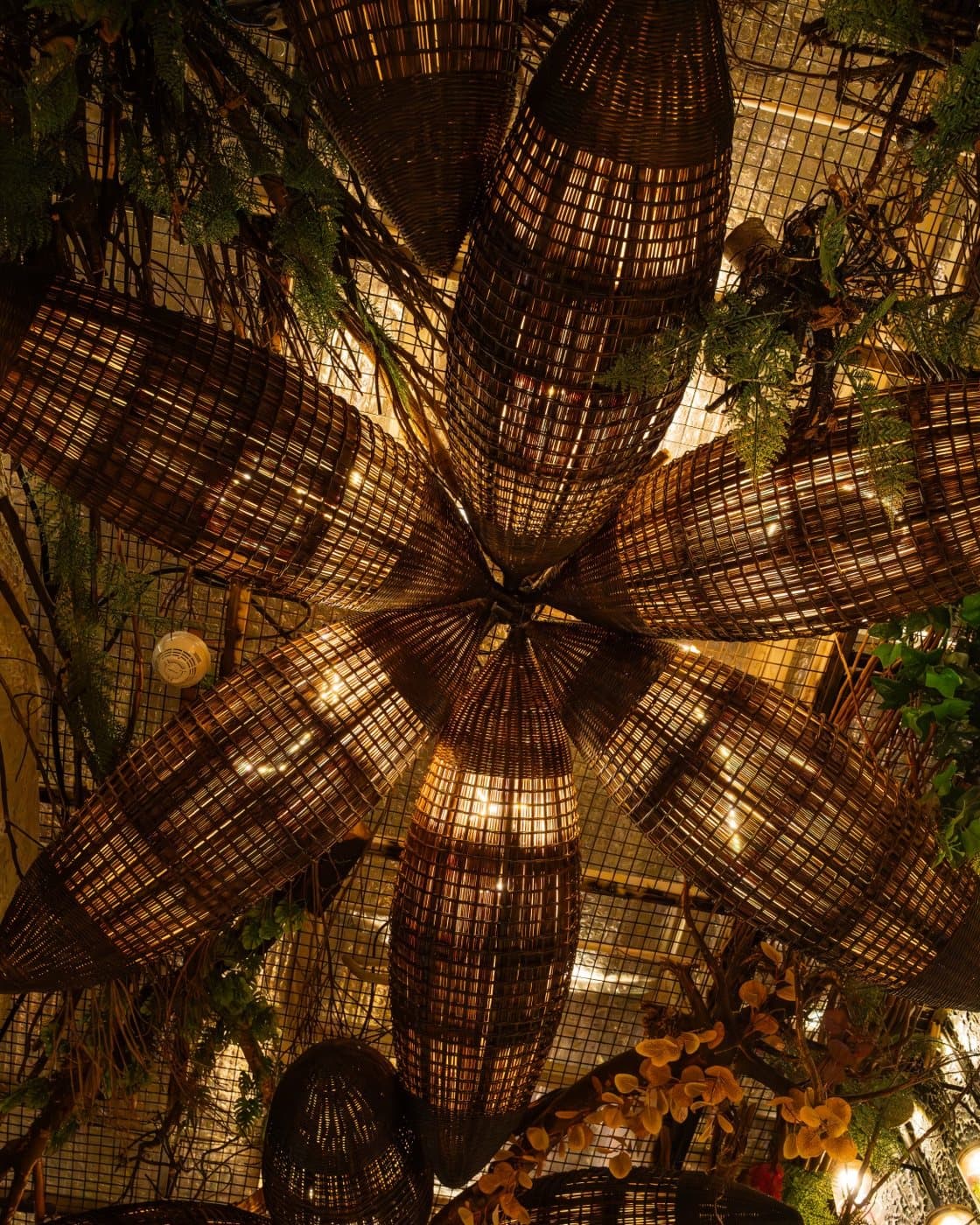Rattan flower chandelier woven into the ceiling