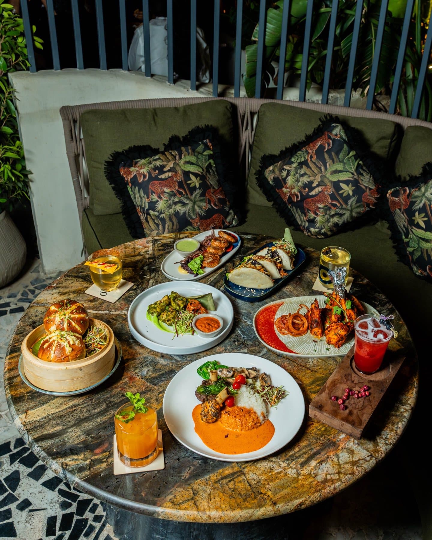 Evening spread across the jungle-print banquette